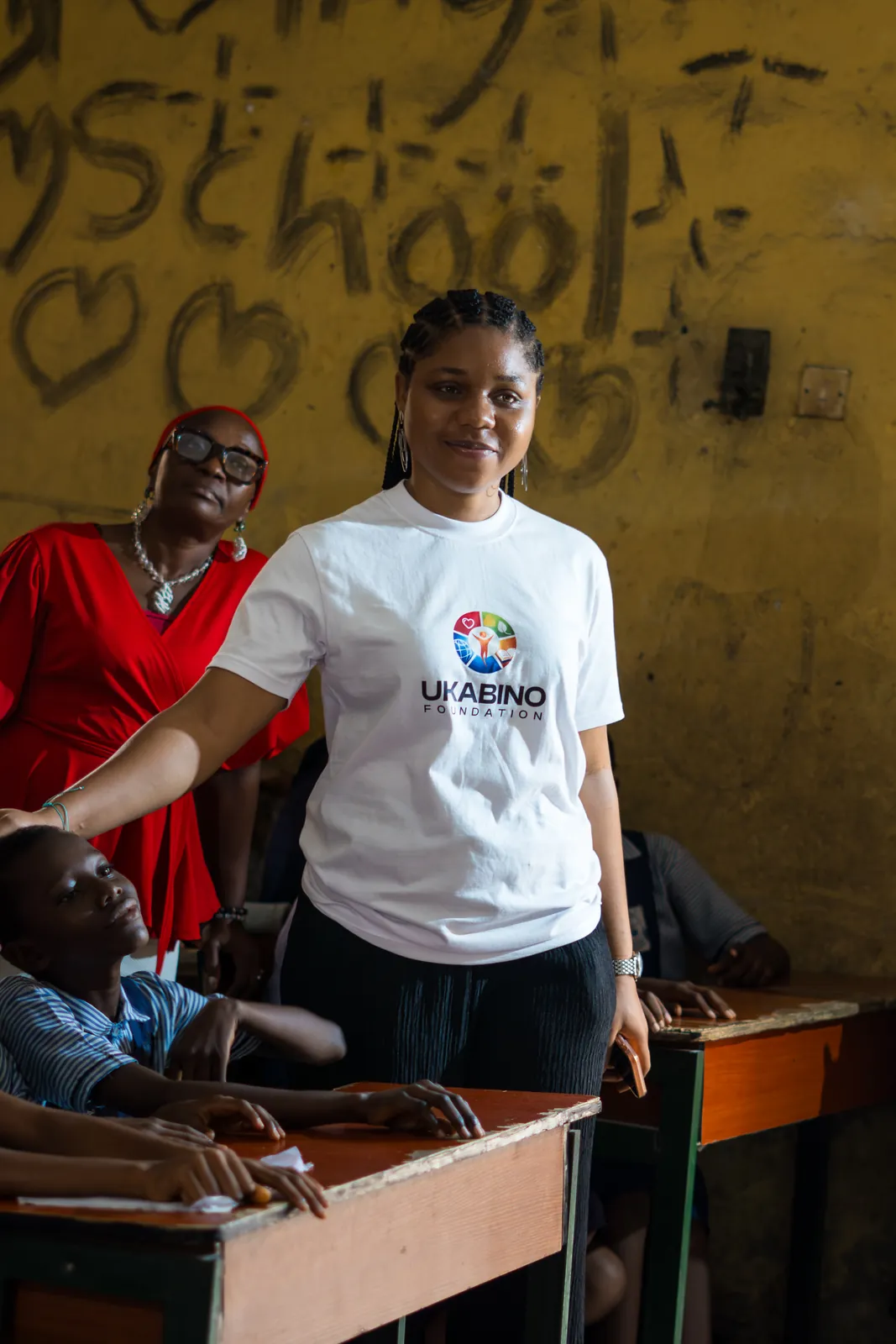 Ukabino team members engaging with students in a classroom