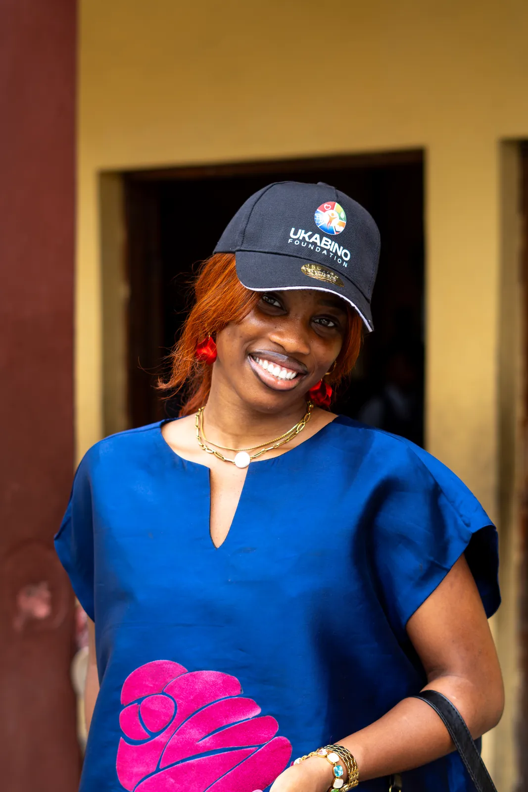 A Ukabino team member wearing a branded cap