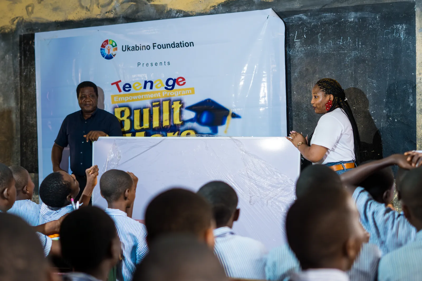 A speaker addressing students at the education programme
