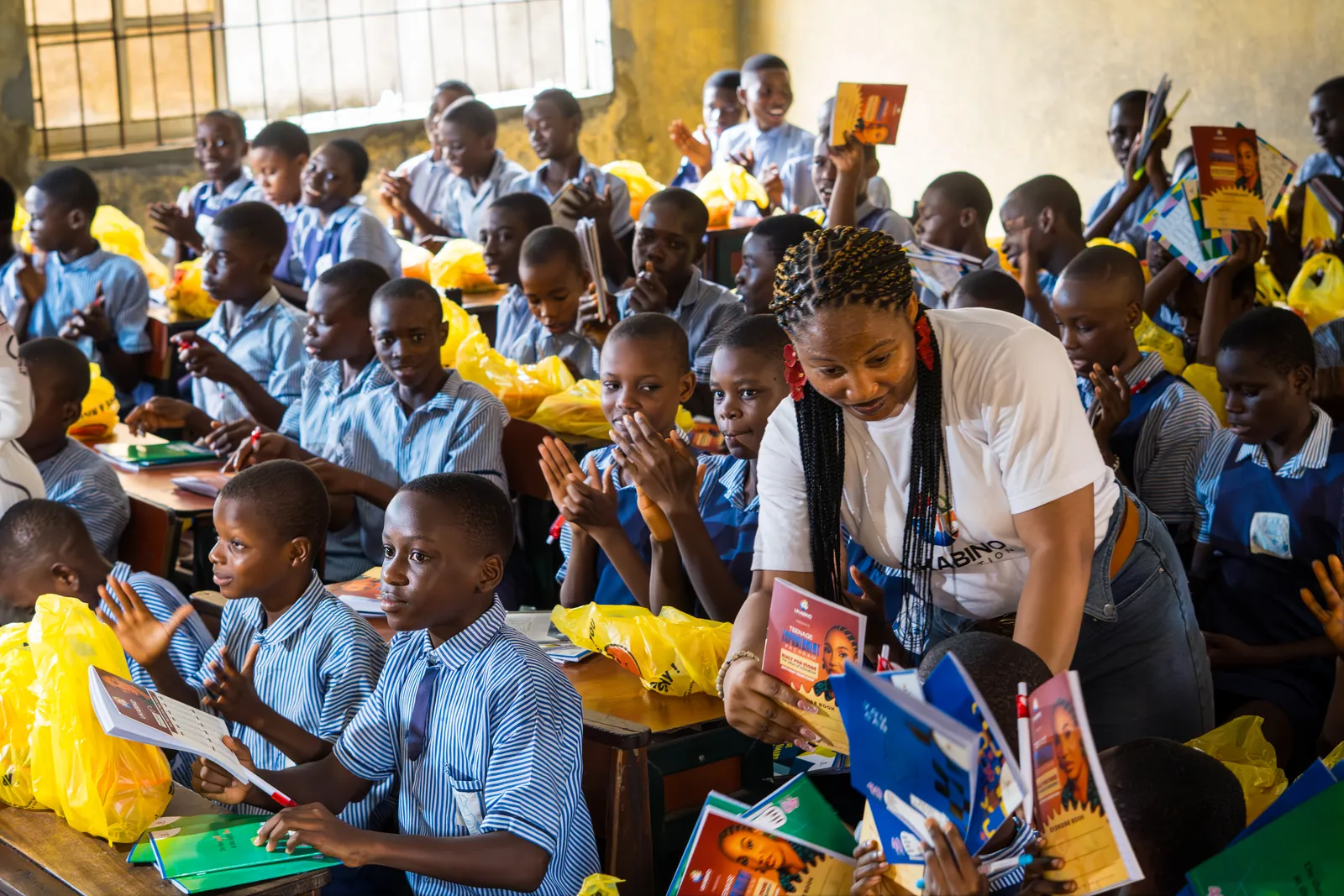 The Ukabino founder sharing books with students