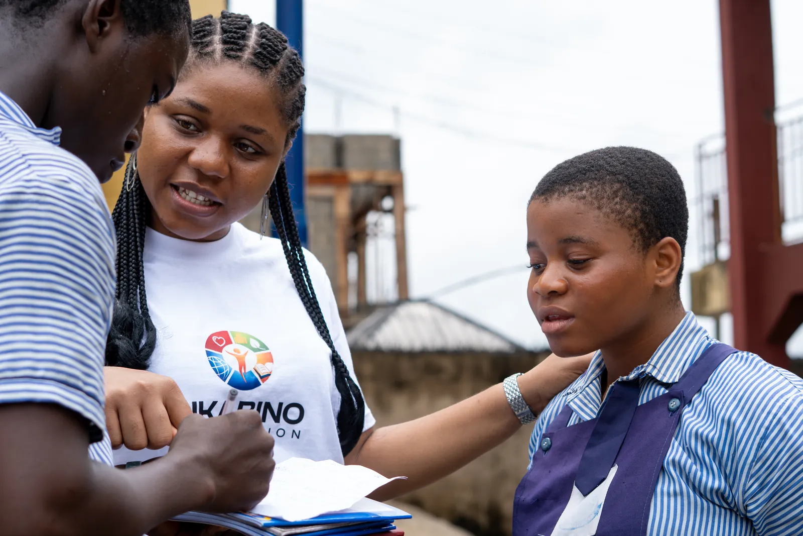 The Ukabino founder reading with a student